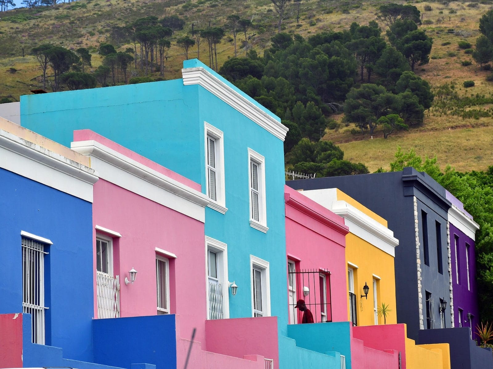 A row of painted houses climbing a cobbled street in Bo-Kaap