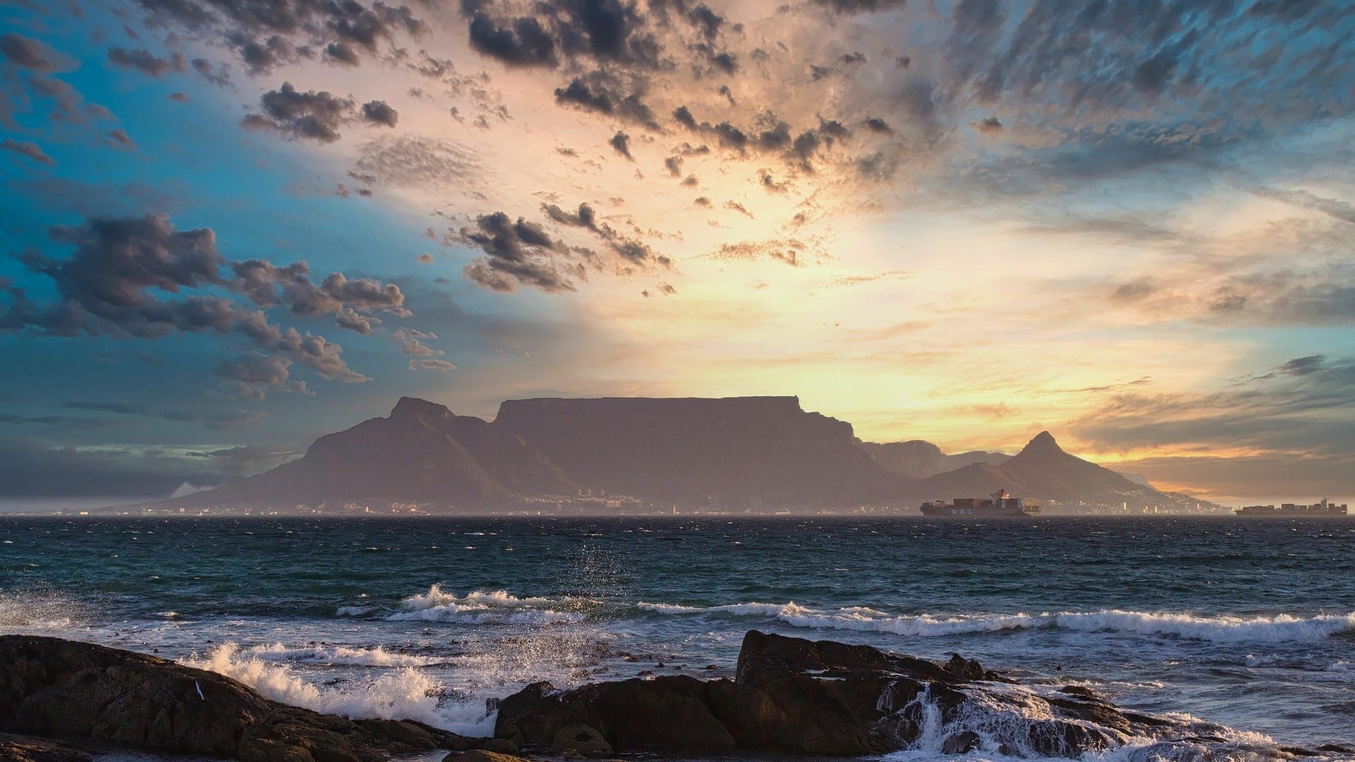 Table Mountain seen across Table Bay from Bloubergstrand at sunset