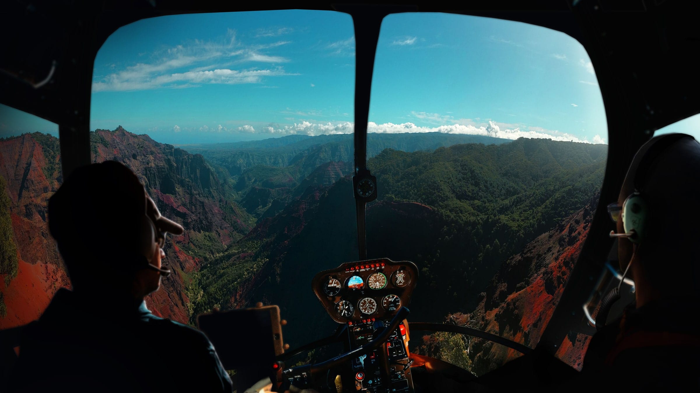 A helicopter flying along the Twelve Apostles ridge above the Atlantic seaboard