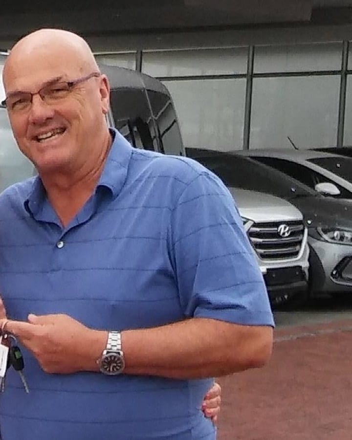 Fred Roberts photographed beside the tour vehicle in Cape Town
