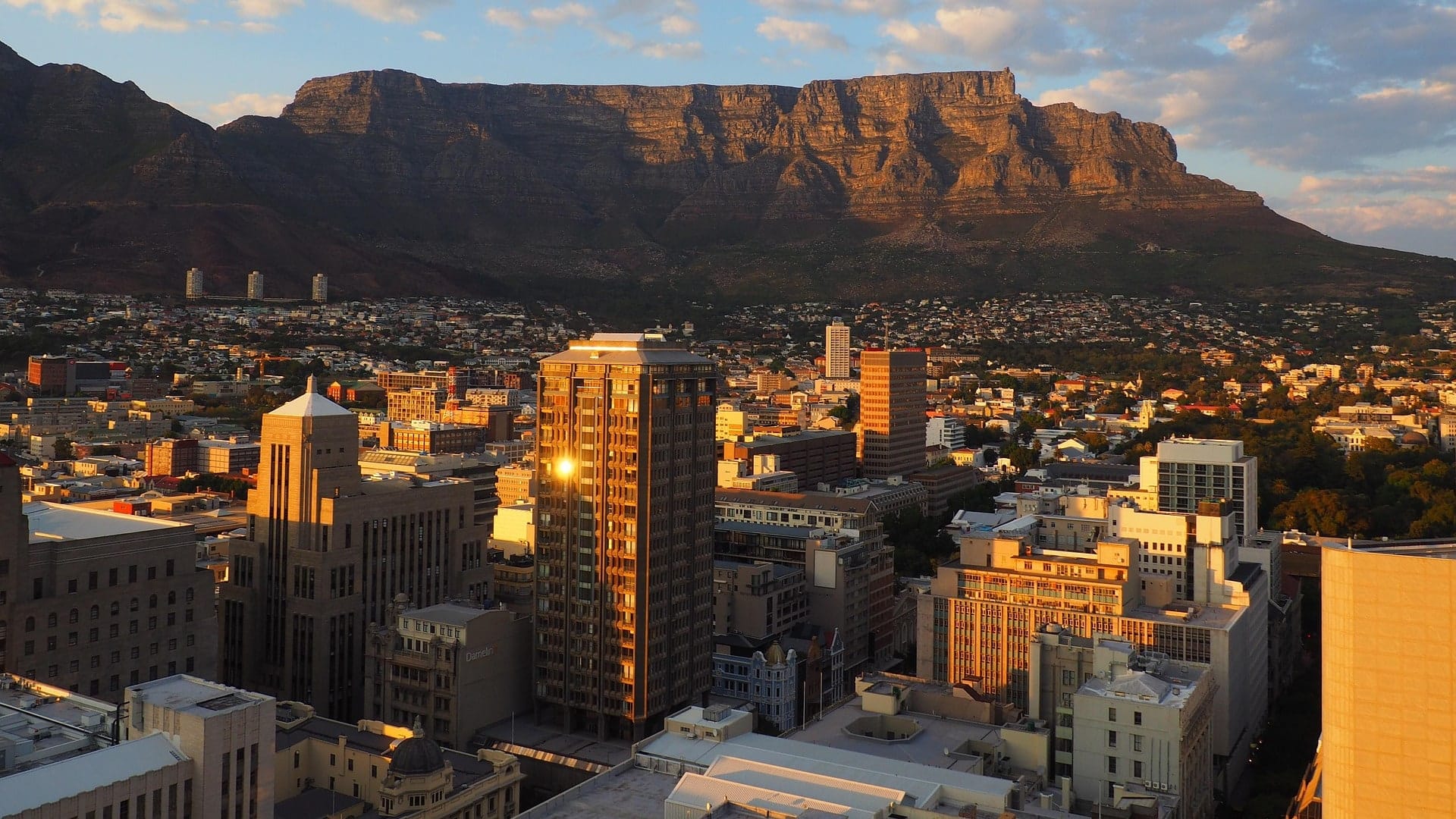 The Cape Town city bowl in golden evening light beneath Table Mountain